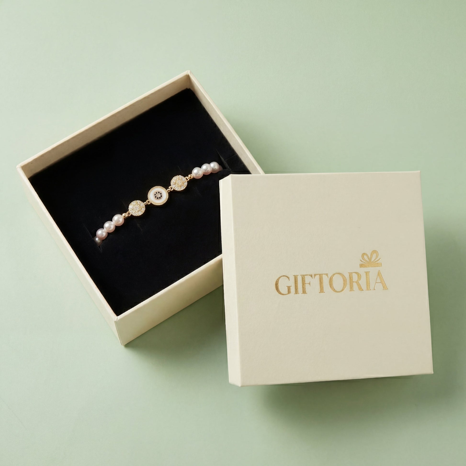 Gold Sunburst Evil Eye Pearl Bracelet presented in a Giftoria jewellery gift box