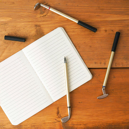 Golf pen set used on notebook as office desk accessory