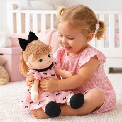 Happy girl holding Mia plush doll toy as kids gift