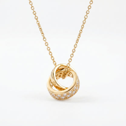 Gold Interlocking Circle Pendant Necklace with sparkling crystal detail on white background