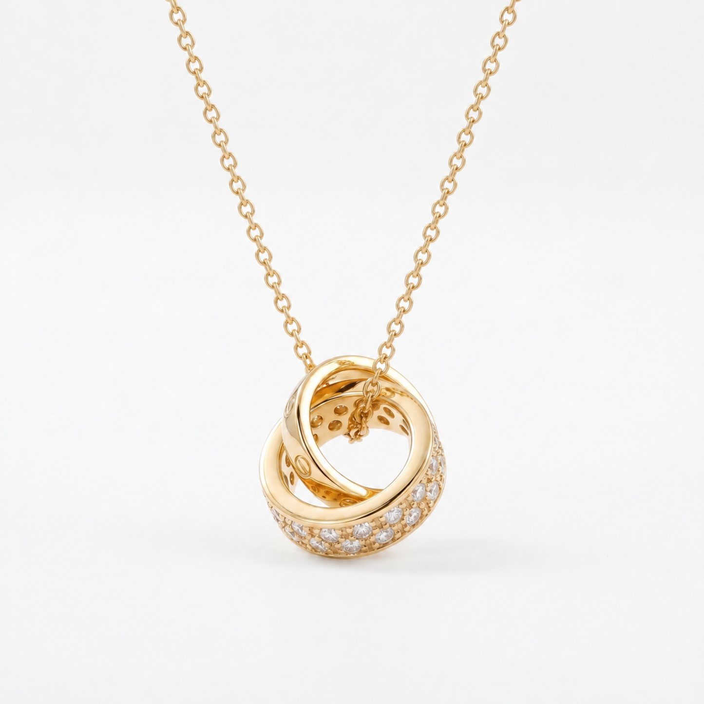 Gold Interlocking Circle Pendant Necklace with sparkling crystal detail on white background