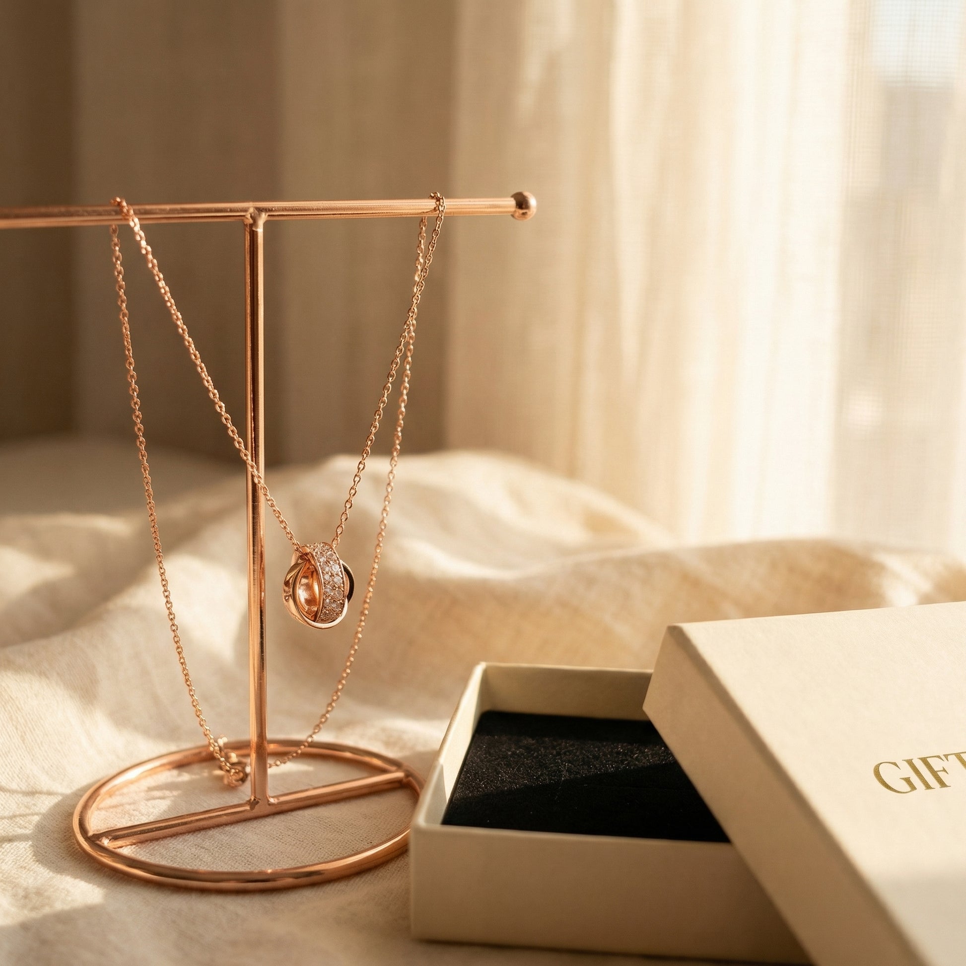 Interlocking Circle Pendant Necklace displayed on jewellery stand with Giftoria gift box