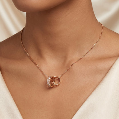 Rose gold Interlocking Circle Pendant Necklace worn on neckline, delicate jewellery gift for women