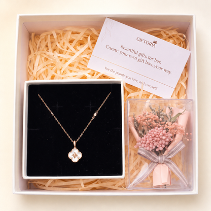 Lucky clover necklace and pink dried flower bouquet presented in a Giftoria gift box