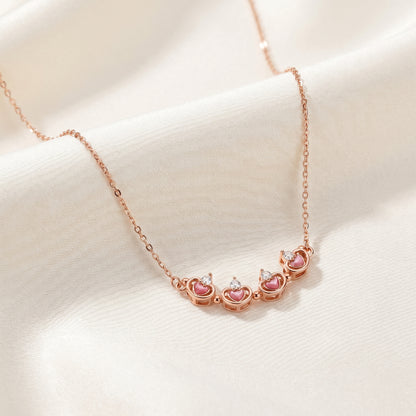 Rose gold magnetic lucky clover necklace opened into delicate petal design