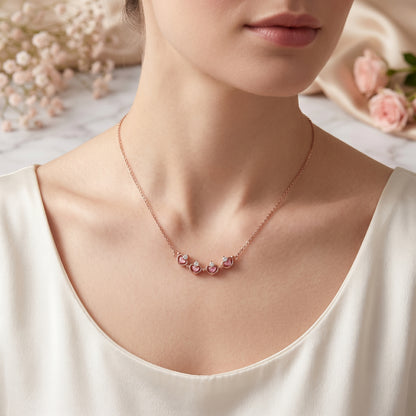 Model wearing open petal rose gold magnetic clover necklace
