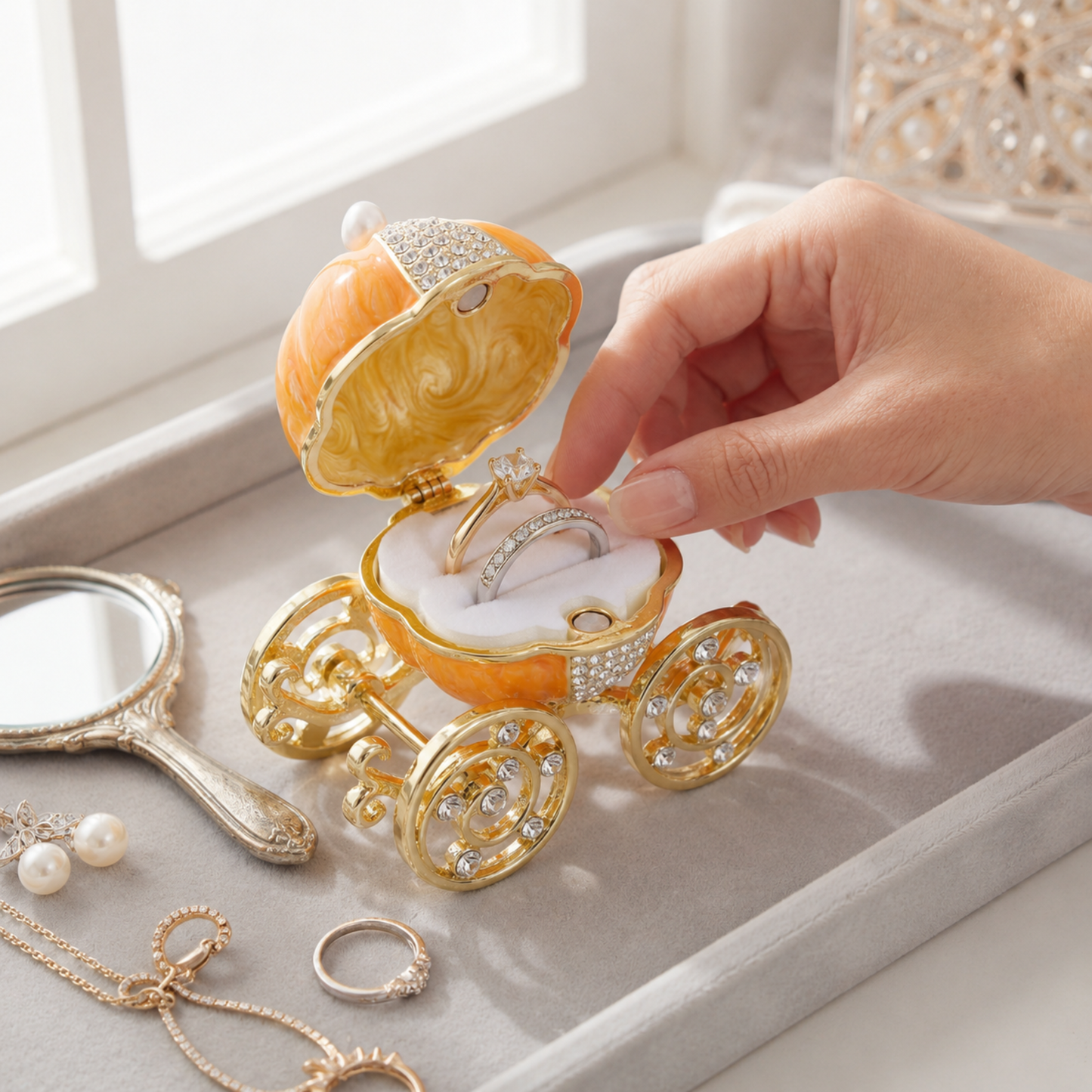 Enchanted Pumpkin Carriage Jewellery Box displaying rings in the removable ring holder
