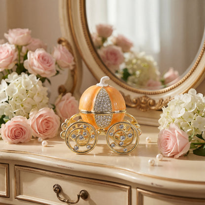 Orange pumpkin carriage jewellery box styled on a vintage dressing table with flowers and mirror, perfect for elegant home decor.