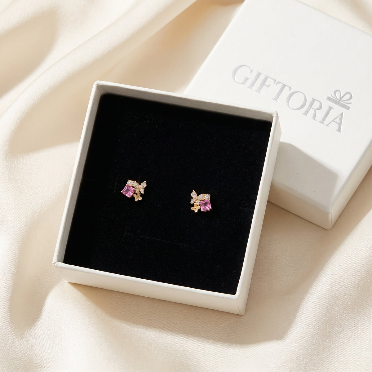Pink Gold Butterfly Garden stud earrings presented in a Giftoria box