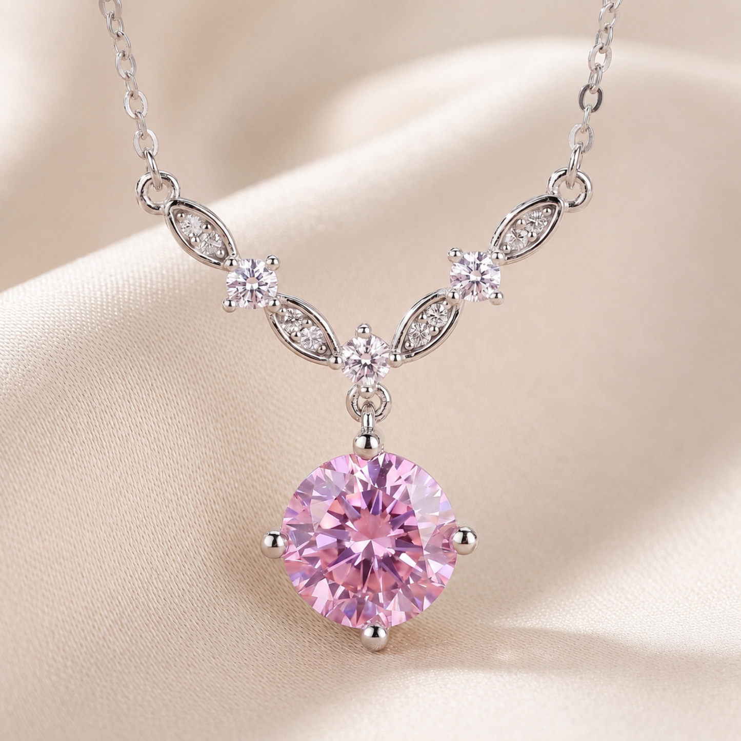 Close up of pink cubic zirconia floral vine necklace with sparkling leaf details