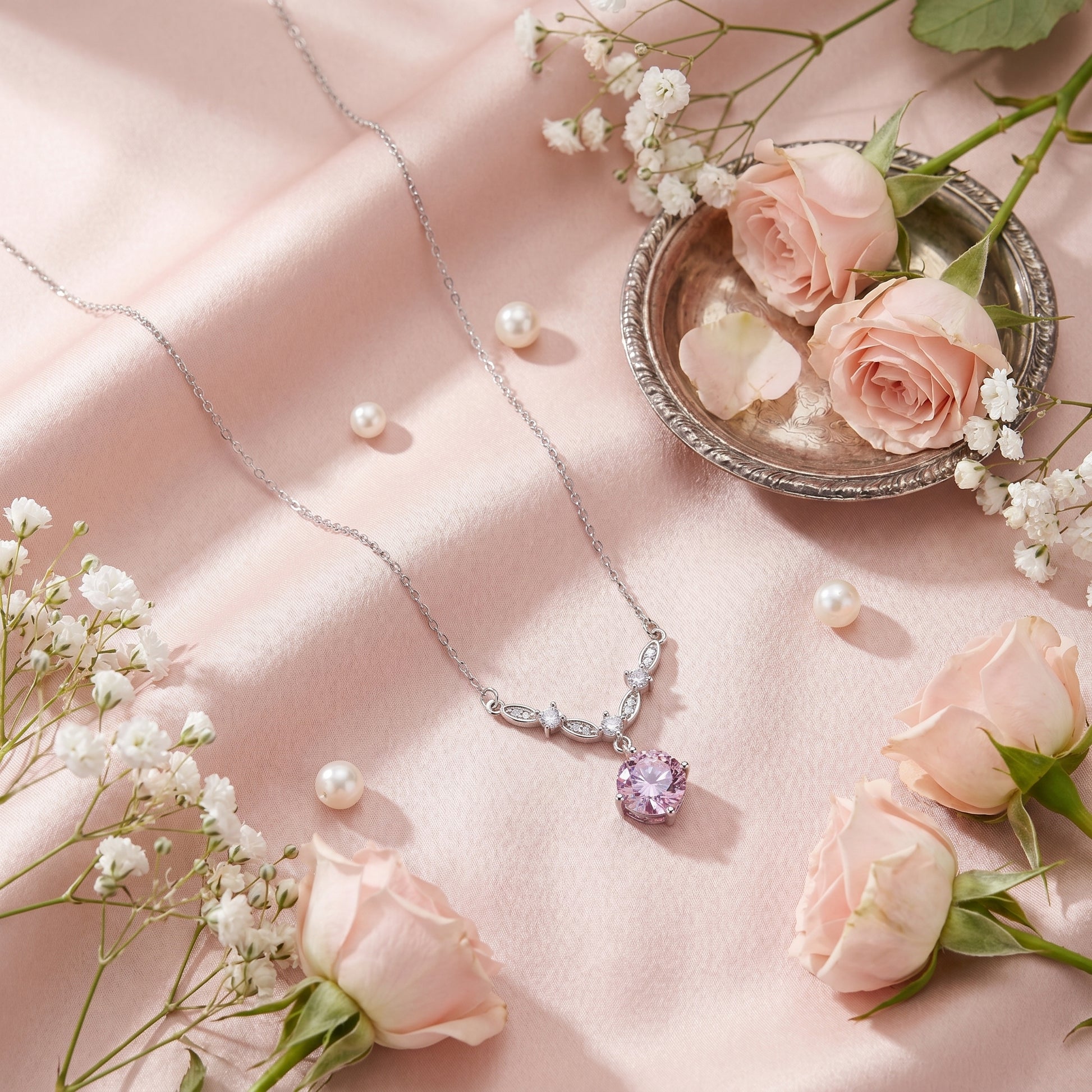 Pink cubic zirconia floral vine necklace styled with roses and pearls