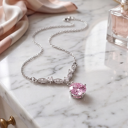 Pink cubic zirconia floral vine necklace on dressing table