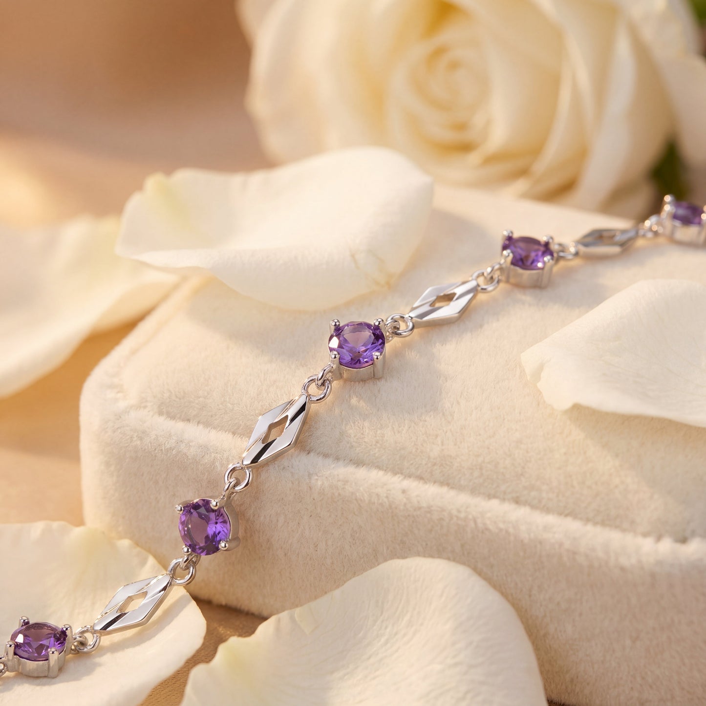 Fine silver purple cubic zirconia bracelet close up showing gemstone and silver chain details