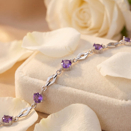 Fine silver purple cubic zirconia bracelet close up showing gemstone and silver chain details