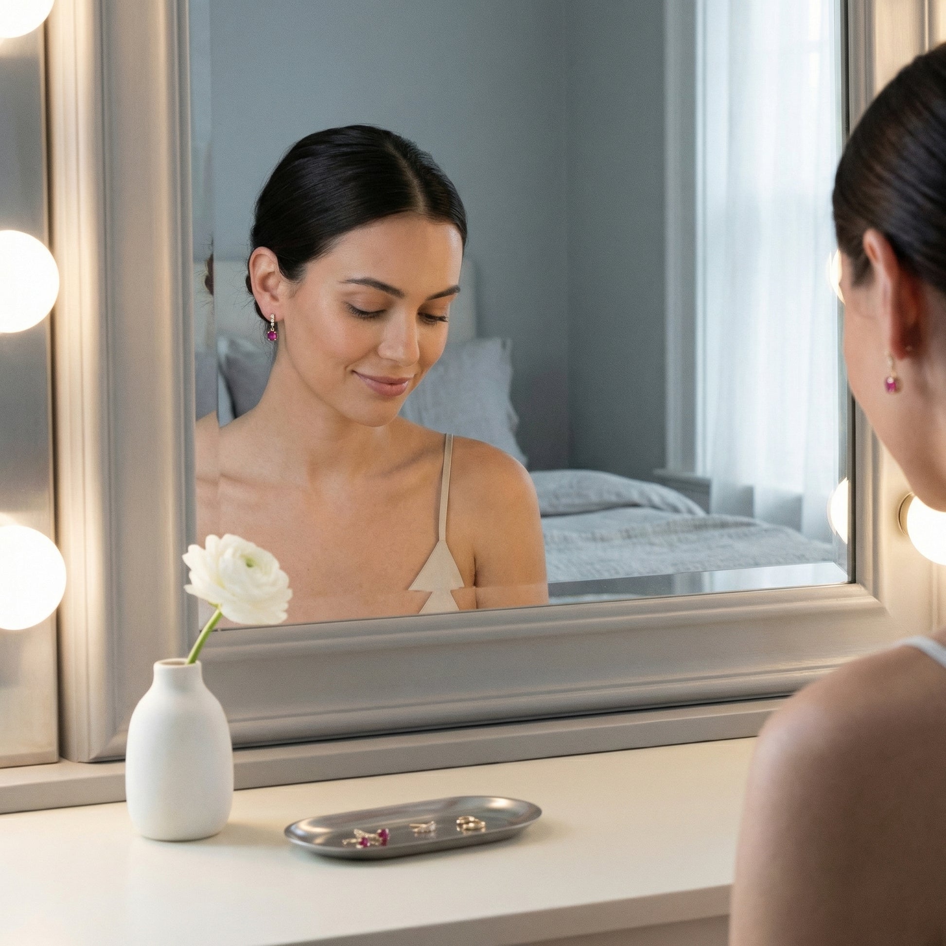 Lifestyle scene featuring 18K gold plated 925 sterling silver red cubic zirconia drop stud earrings