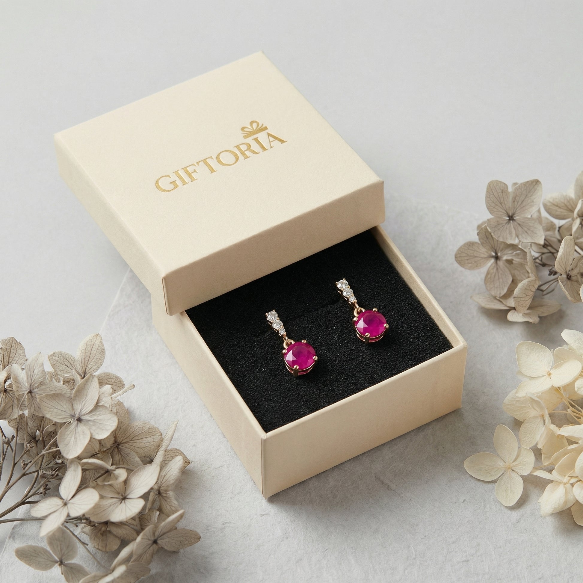 18K gold plated 925 sterling silver red cubic zirconia drop stud earrings displayed in jewellery gift box