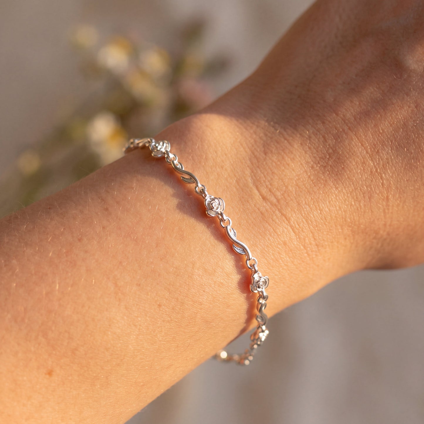 Rose of Love 925 sterling silver bracelet worn on the wrist, showing its elegant and romantic fit.