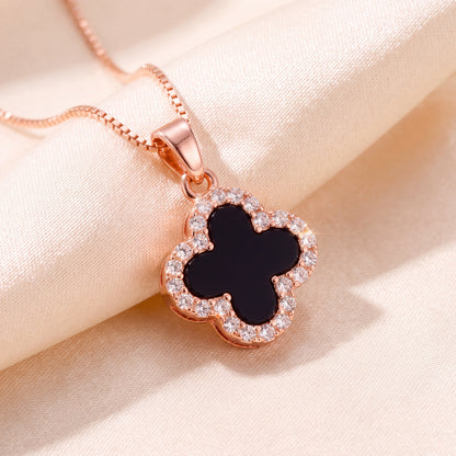 rose gold black four leaf clover pendant necklace close up