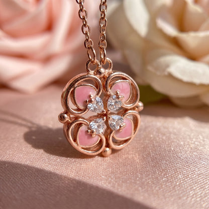 Close up of rose gold magnetic lucky clover necklace with sparkling zircon details
