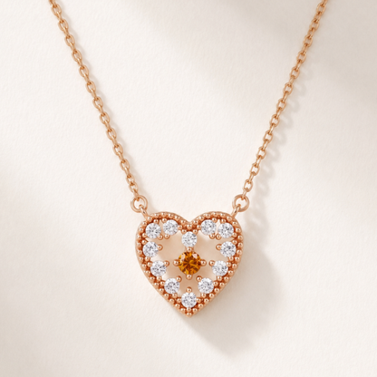 Rose gold 925 sterling silver red sparkle heart pendant necklace on a white background