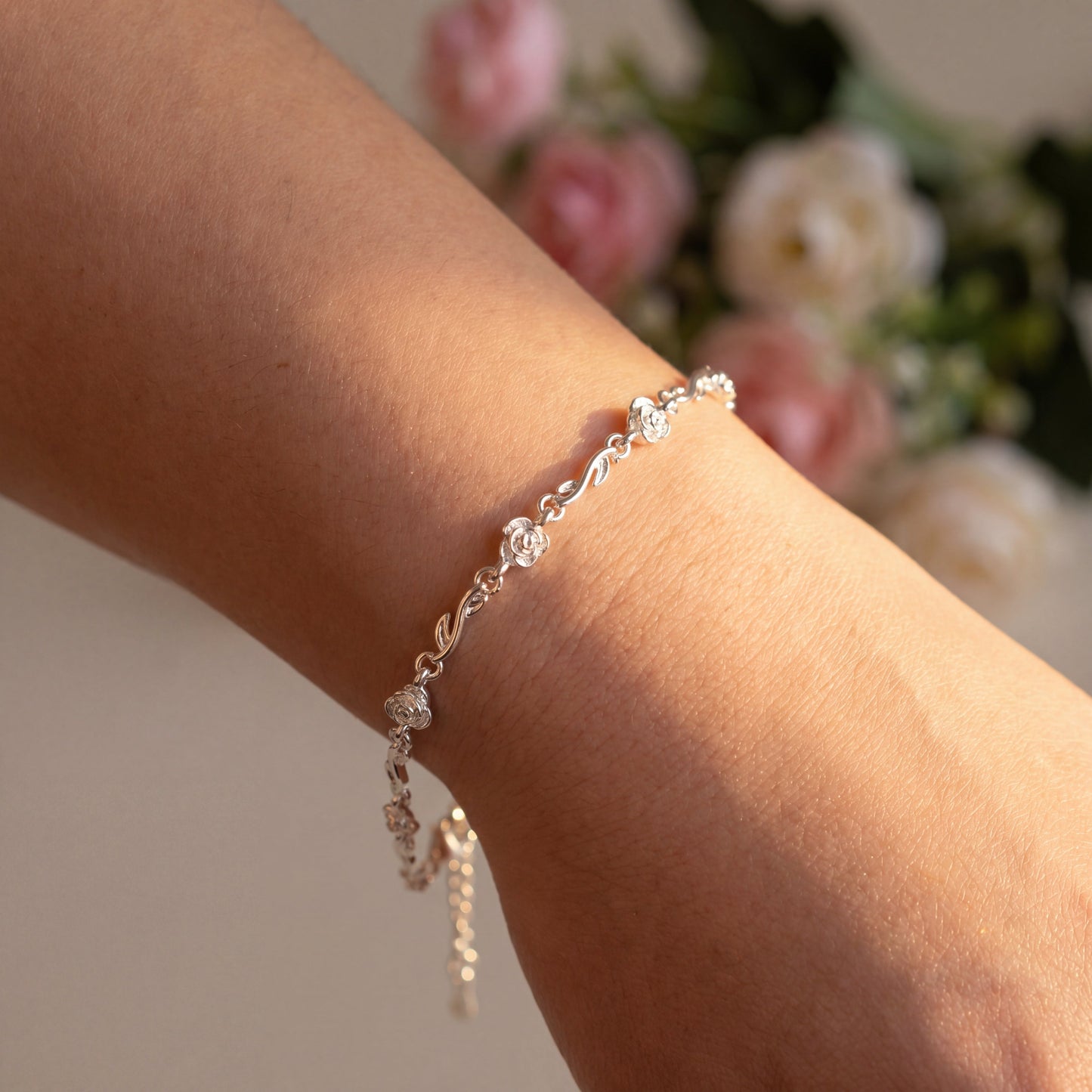 Rose 925 sterling silver bracelet shown on the wrist, a delicate jewellery gift for her.