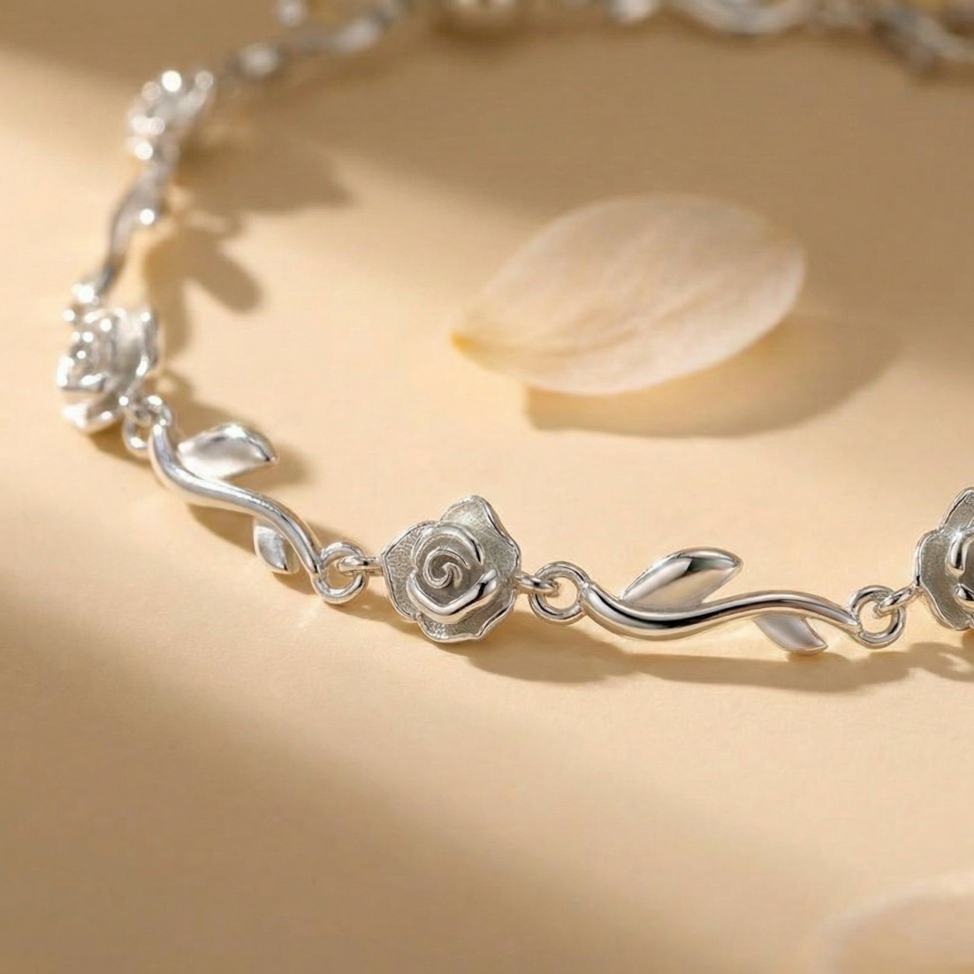 Close-up detail of the Rose of Love 925 sterling silver bracelet featuring delicate rose and vine accents.