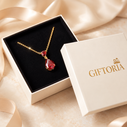 Ruby Glow red teardrop necklace presented in a Giftoria jewellery gift box