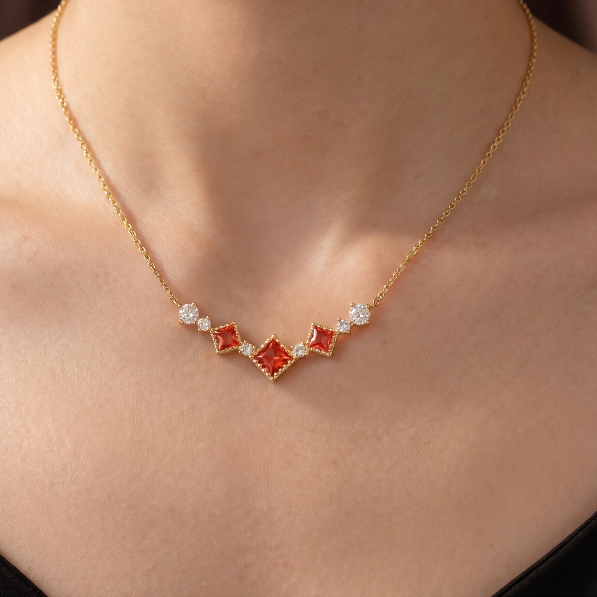 Gold Scarlet Vintage red cubic zirconia necklace worn on a woman's neckline