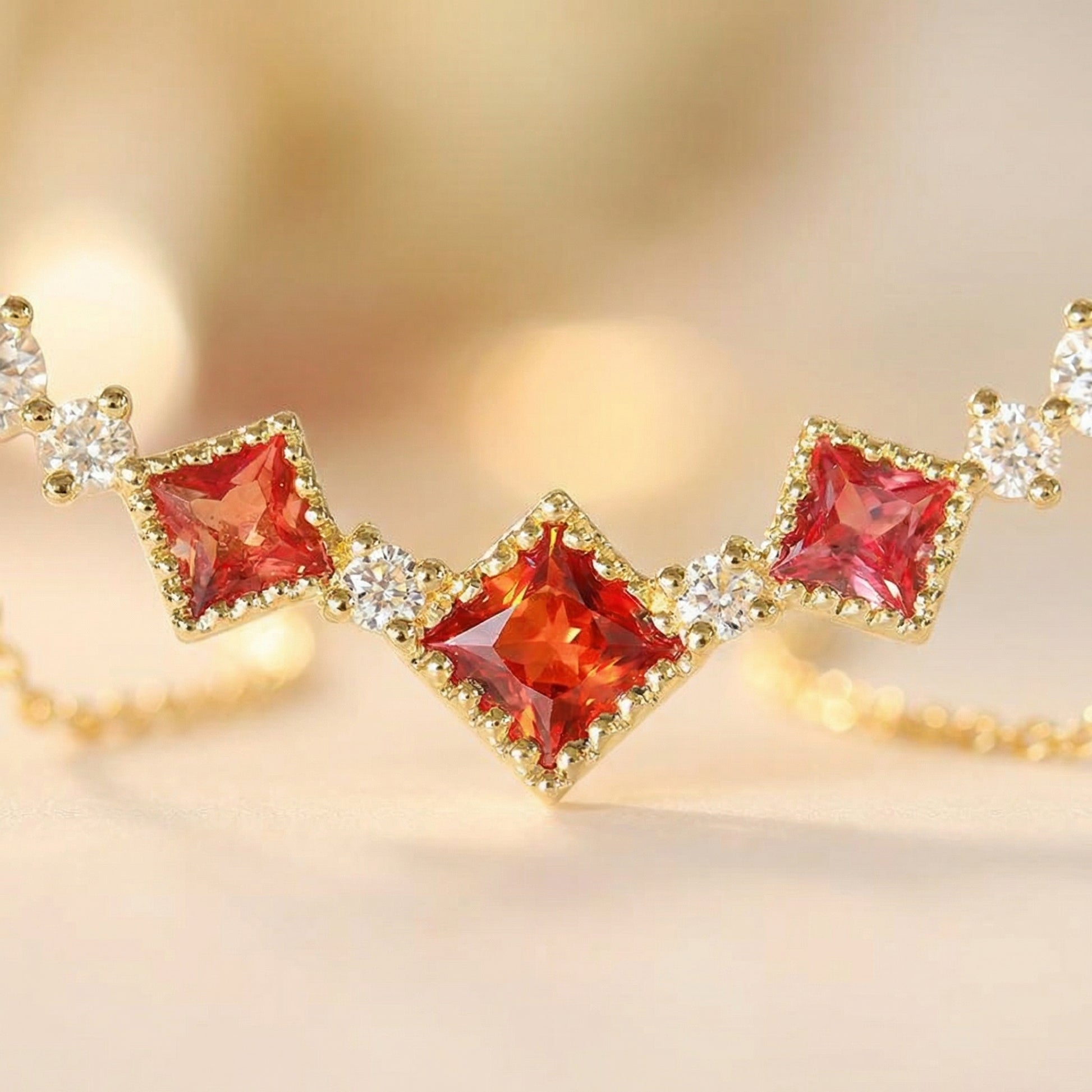 Close-up of red cubic zirconia stones on a vintage 925 sterling silver necklace