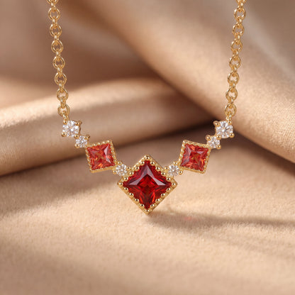 Scarlet vintage red cubic zirconia necklace styled on soft silk for a luxury gift look
