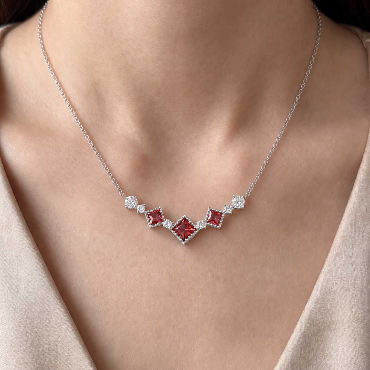 Silver Scarlet Vintage red cubic zirconia necklace worn with an elegant neutral outfit