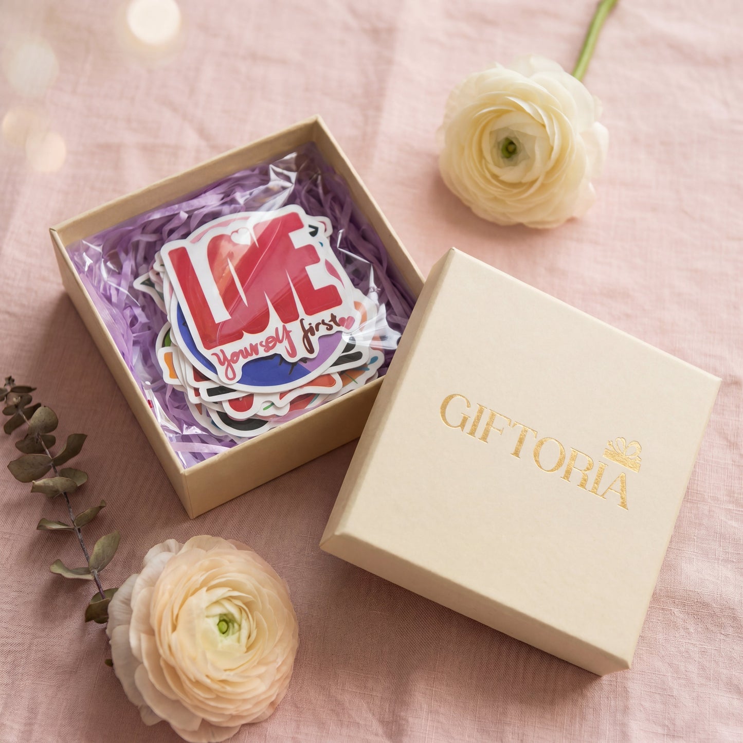 Self-Love Motivational Quote Stickers 50-Pack styled in a Giftoria gift box with flowers, showing premium gift-ready packaging for a thoughtful self-love gift.