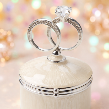 Close-up of sparkling crystal and double wedding rings design on jewellery box