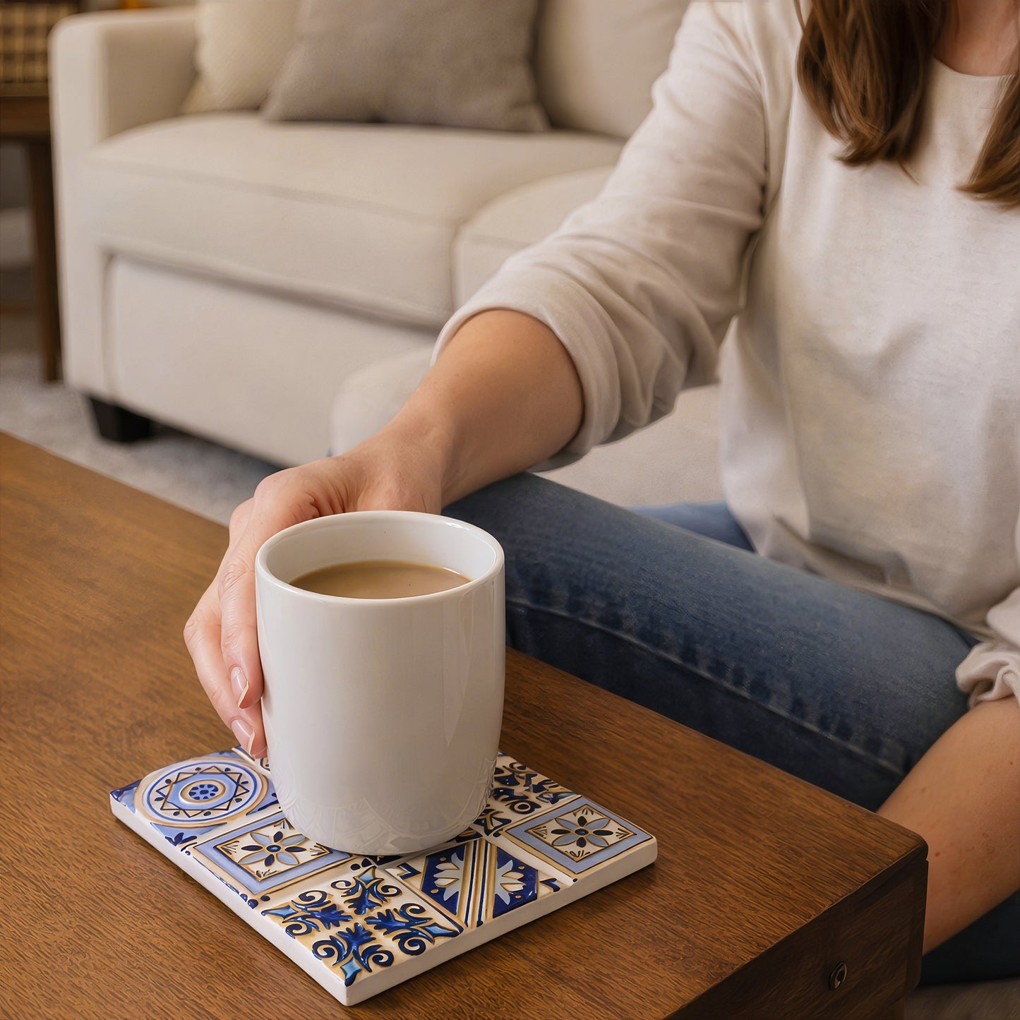 Square ceramic coaster set 4pcs with coffee mug on wooden table in living room