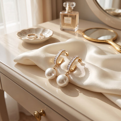 Statement Sparkling Baguette Pearl Drop Earrings styled on an elegant dressing table