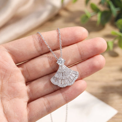 Vintage fan pendant necklace held in hand showing delicate size and sparkling 925 sterling silver detail