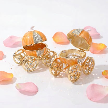 Vintage orange pumpkin carriage jewellery box with gold wheels and sparkling details, a unique decorative gift for her.