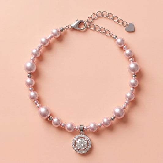 Vintage Pearl Sparkle Charm Bracelet with pink pearls and crystal pendant on soft blush background