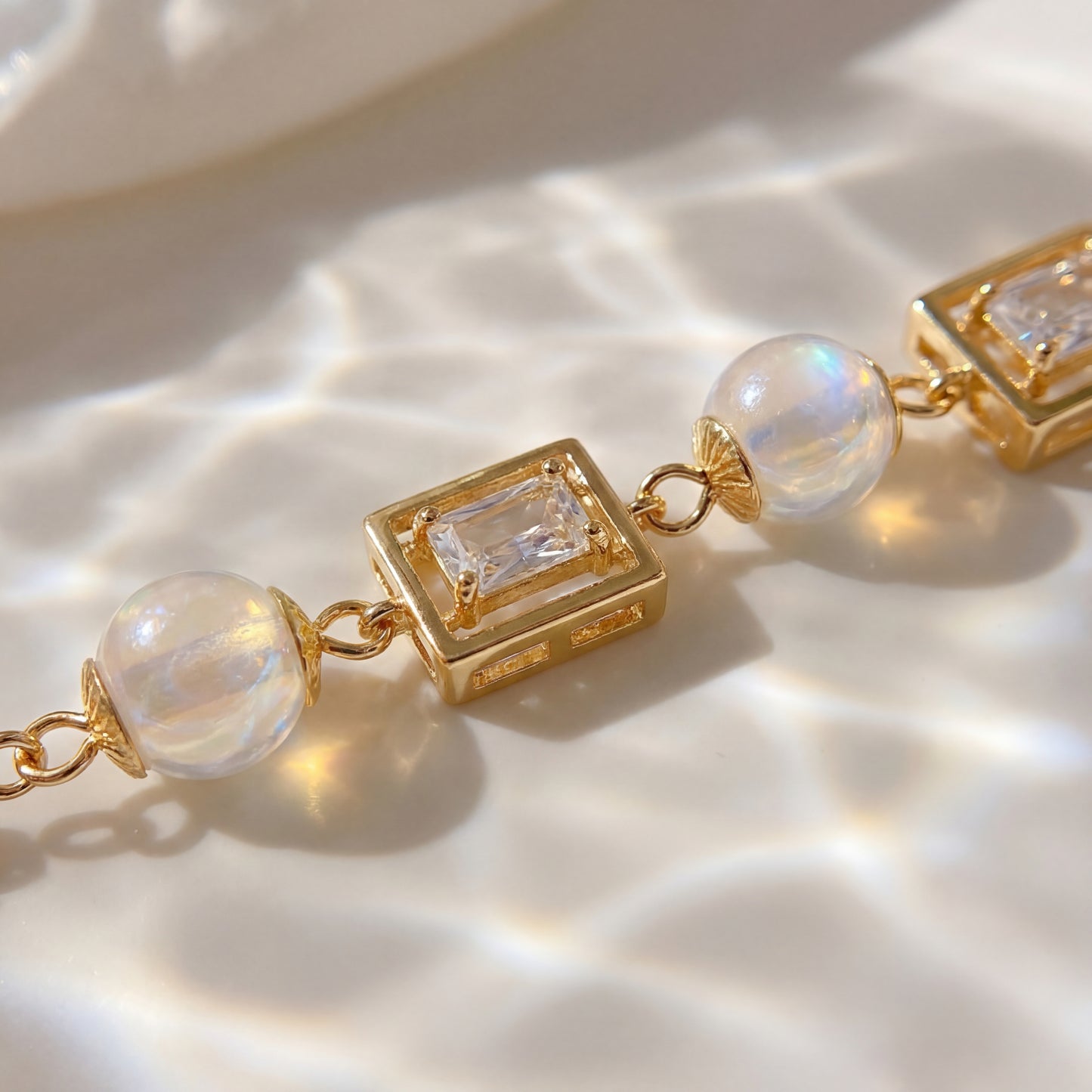 Close up detail of vintage pearl square cubic zirconia gold bracelet showing pearl and crystal design