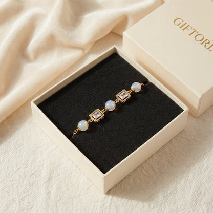 Vintage pearl square cubic zirconia gold bracelet presented in a gift box