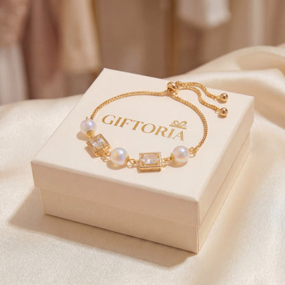 Gift ready vintage pearl square cubic zirconia gold bracelet displayed on branded box