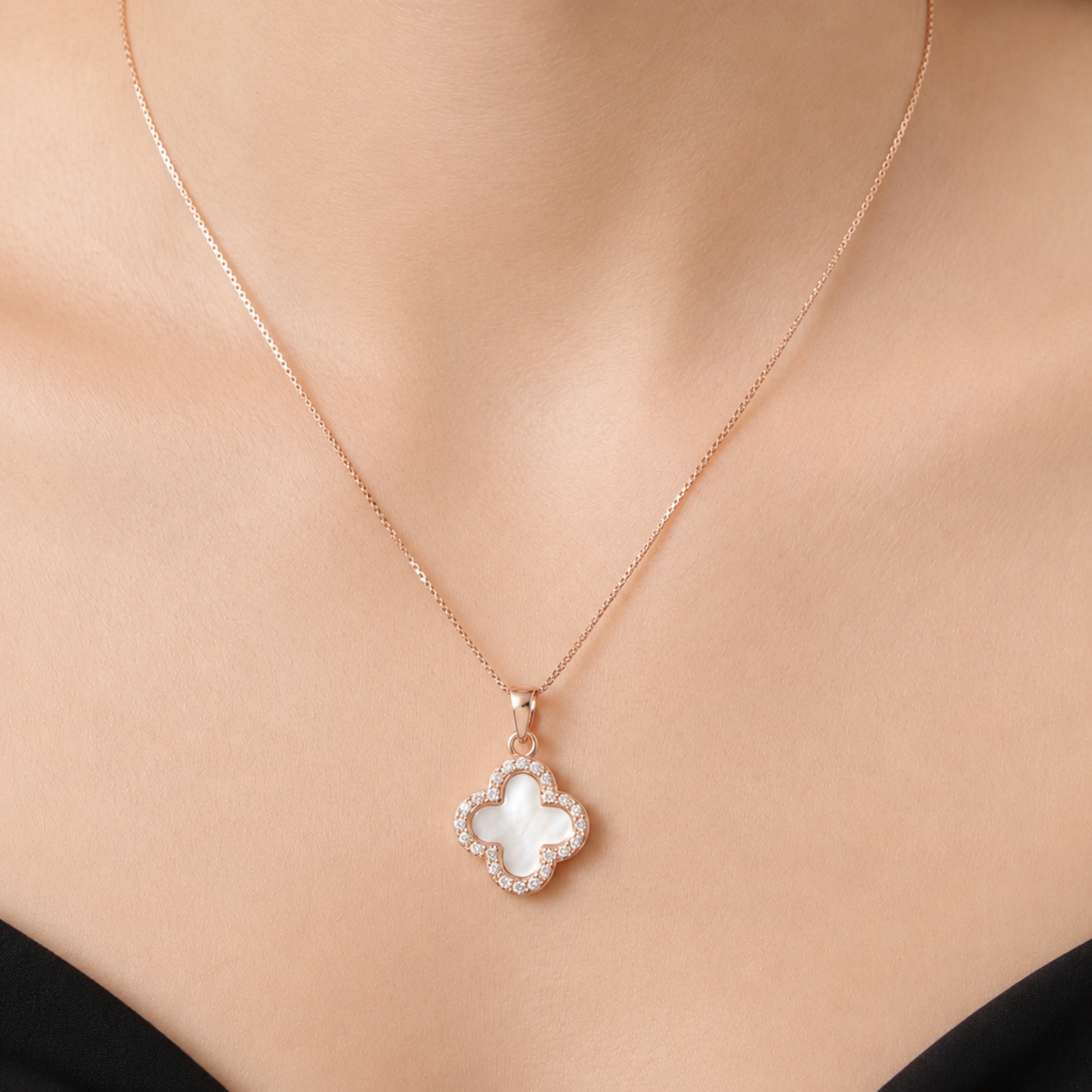 white four leaf clover pendant necklace with rose gold chain worn by model