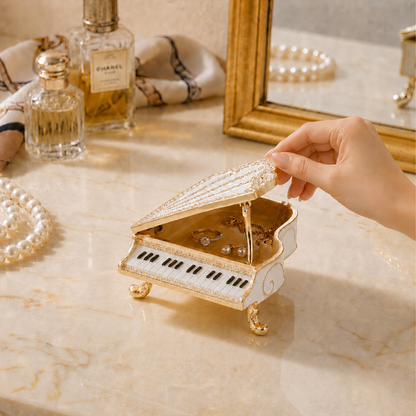 Woman opening a white crystal grand piano jewellery box