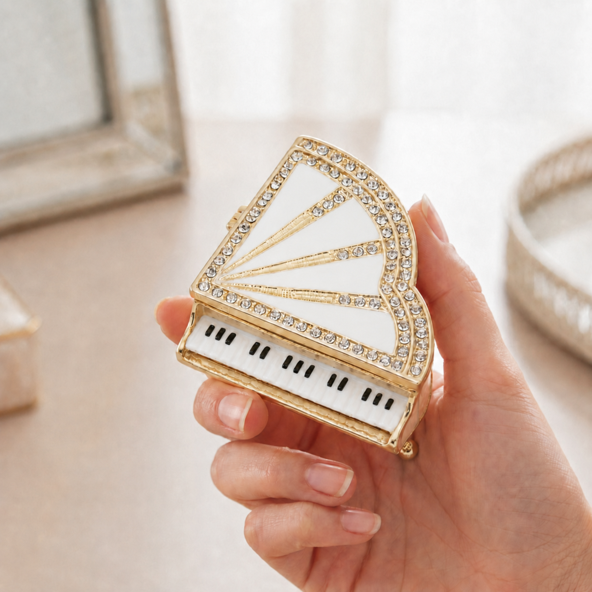 White miniature crystal grand piano jewellery box held in hand